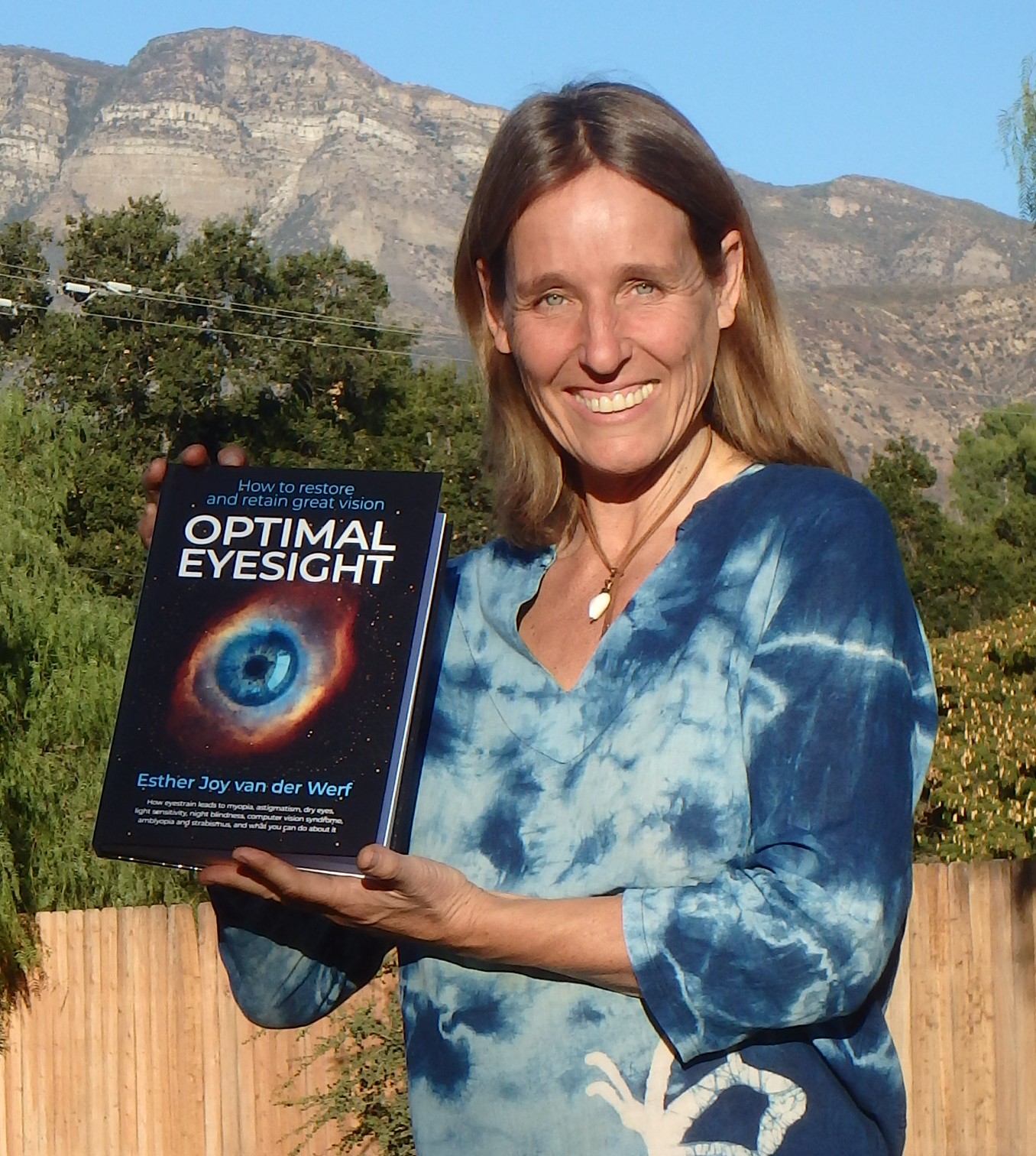 Esther holding Optimal Eyesight hardcover book
